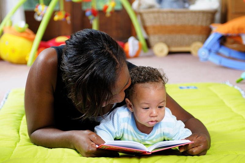 Decorative image - mum reading to baby